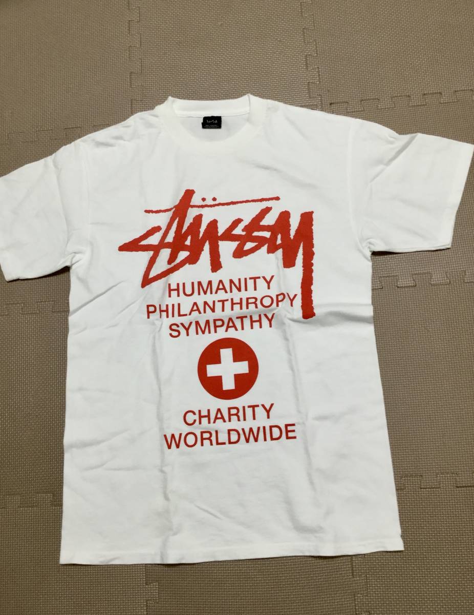 ステューシー 白Tシャツ 赤文字 charity worldwide Mサイズ stussy の