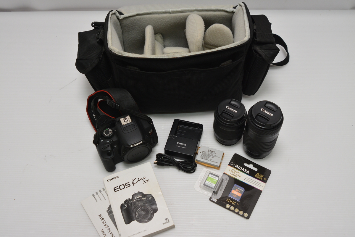 099-m751 Canon キヤノン EOS Kiss X7i ダブルズームキットAFデジタル一眼レフカメラ CMOSセンサー 約1800万画素 ケース SDカード付の1番目の画像
