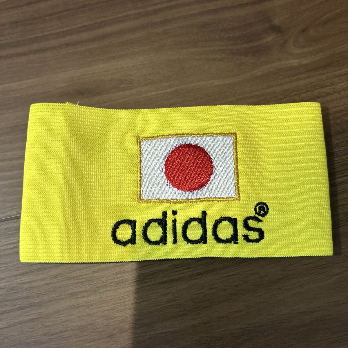 adidas 】アディダス キャプテンマーク オレンジ×ブラック 腕章の落札